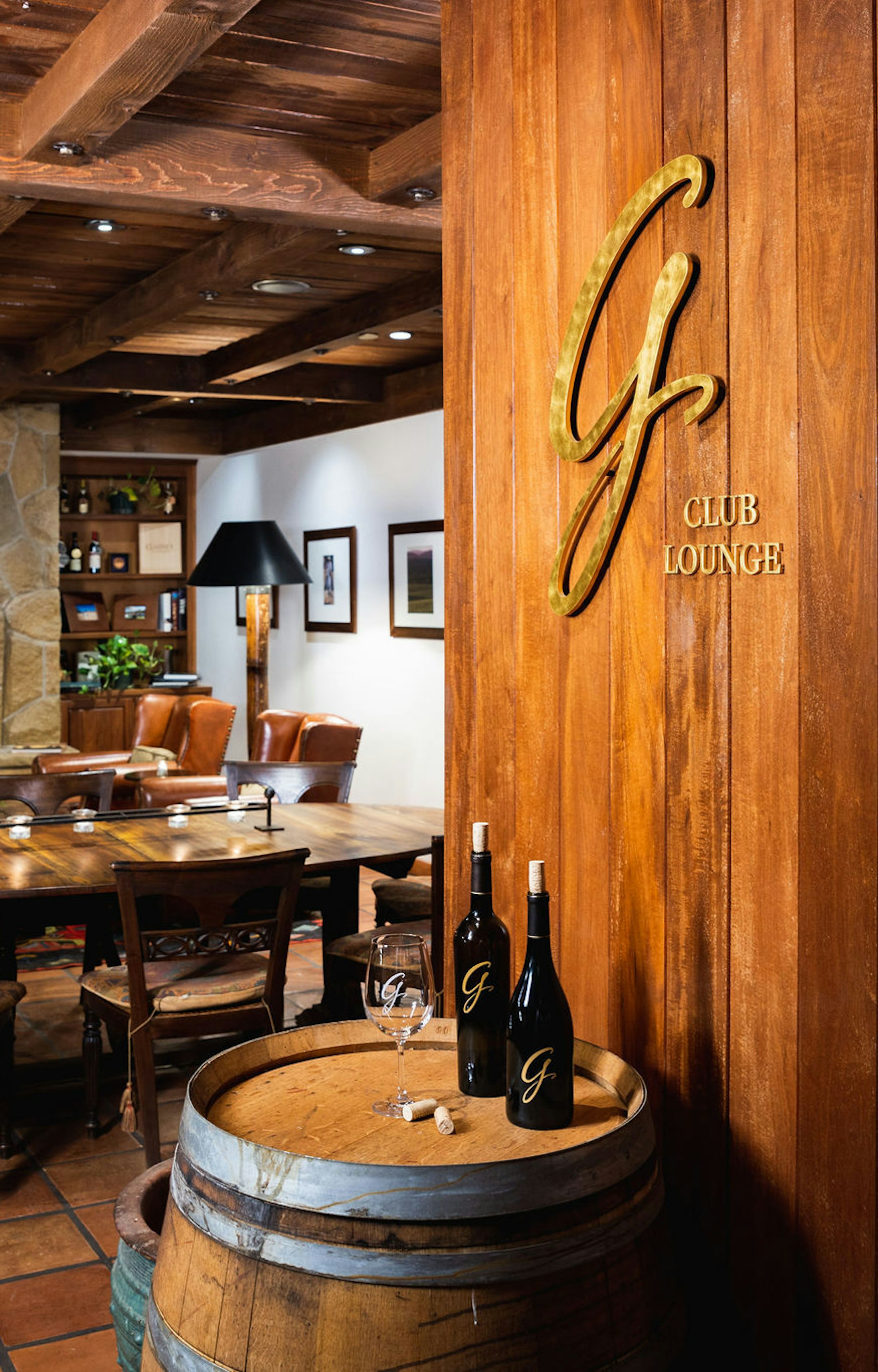 The Gainey club lounge, a cozy room ranch style with a lit fireplace.