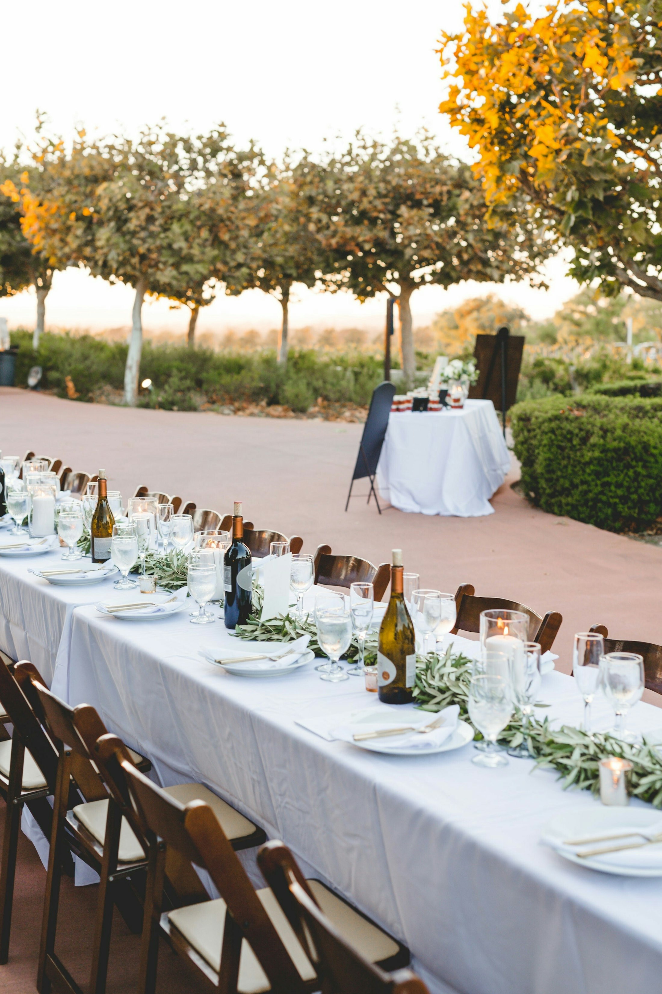 Wedding reception tables with plates and wine