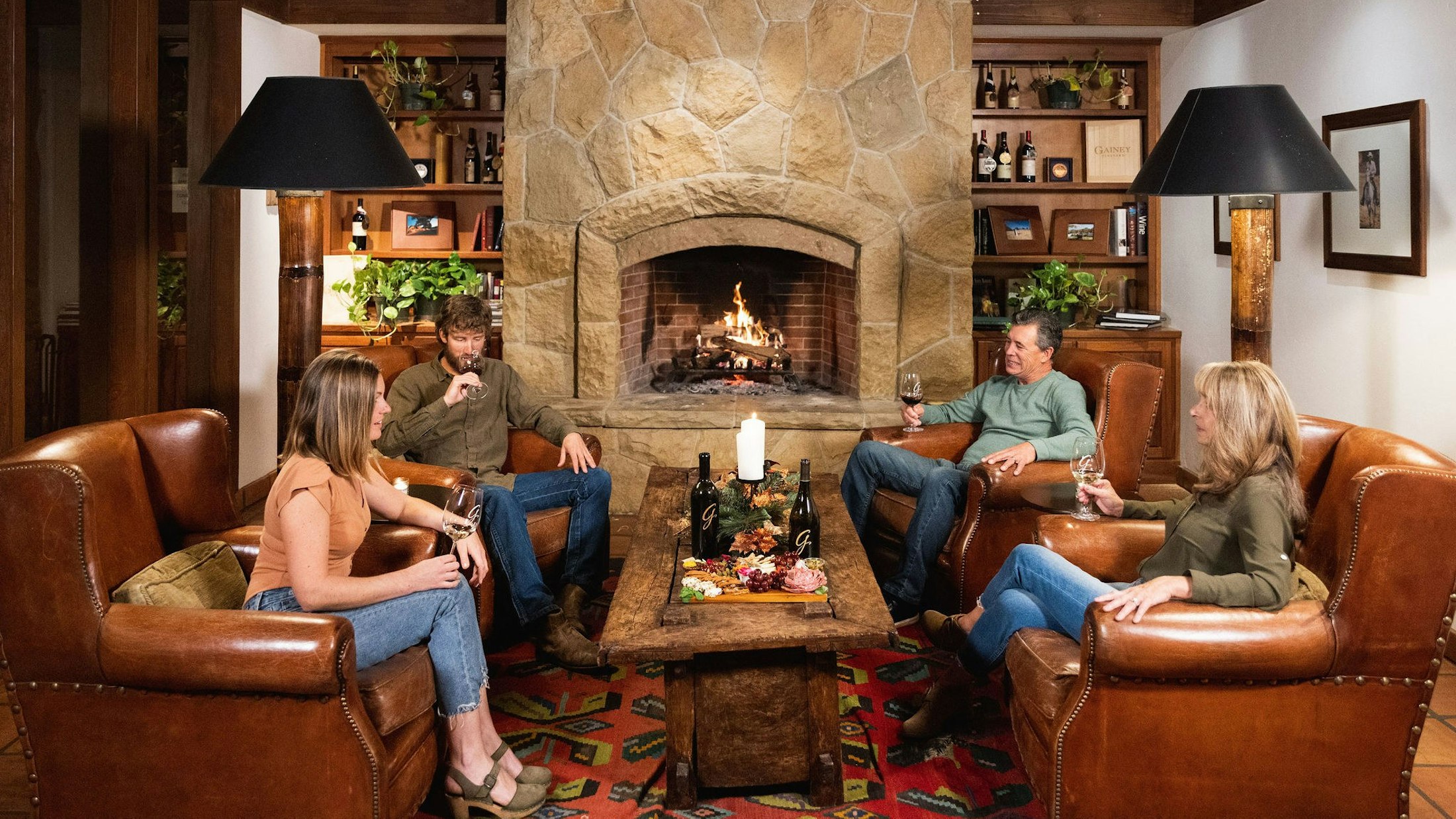 People drinking wine in the Gainey club room